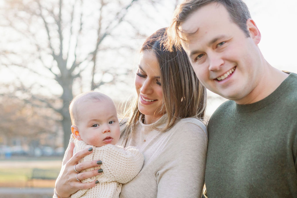 young couple hold young infant son for christmas card photos dayton ohio