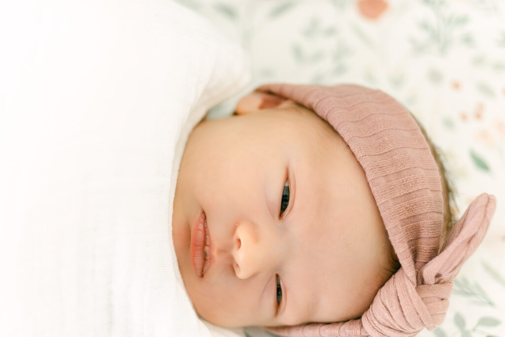 newborn baby girl swaddled in crib, dayton photographer 