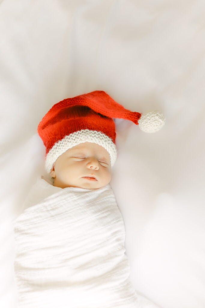 fairborn ohio newborn baby girl in tin crocheted santa hat 