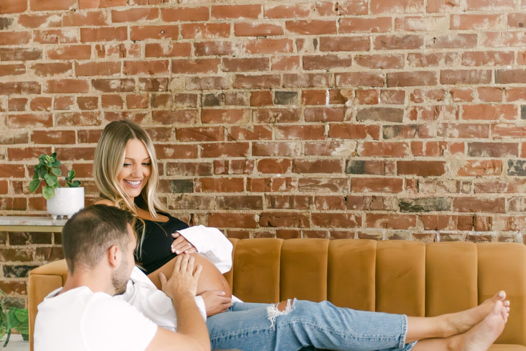 expectant mother and father pose for photographer in cincinnati ohio 