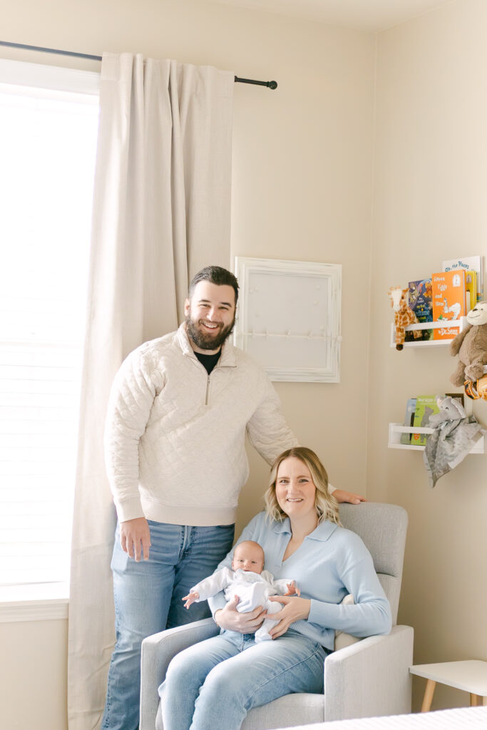 family pose for photos in cincinnati home 