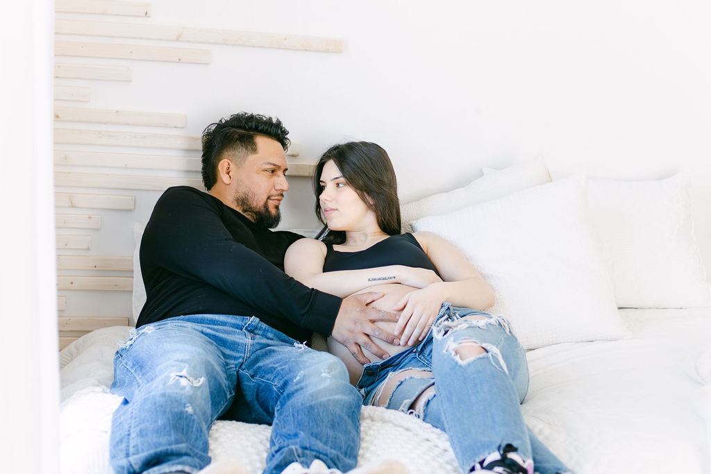 young couple including pregnant mama pose for photographer in dayton metro area 