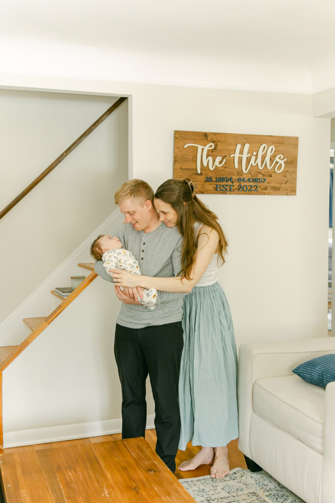 family poses for professional photographs with infant son in dayton ohio