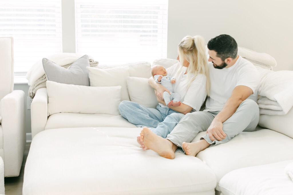 family newborn photography session in home in morrow ohio on couch in the living room
